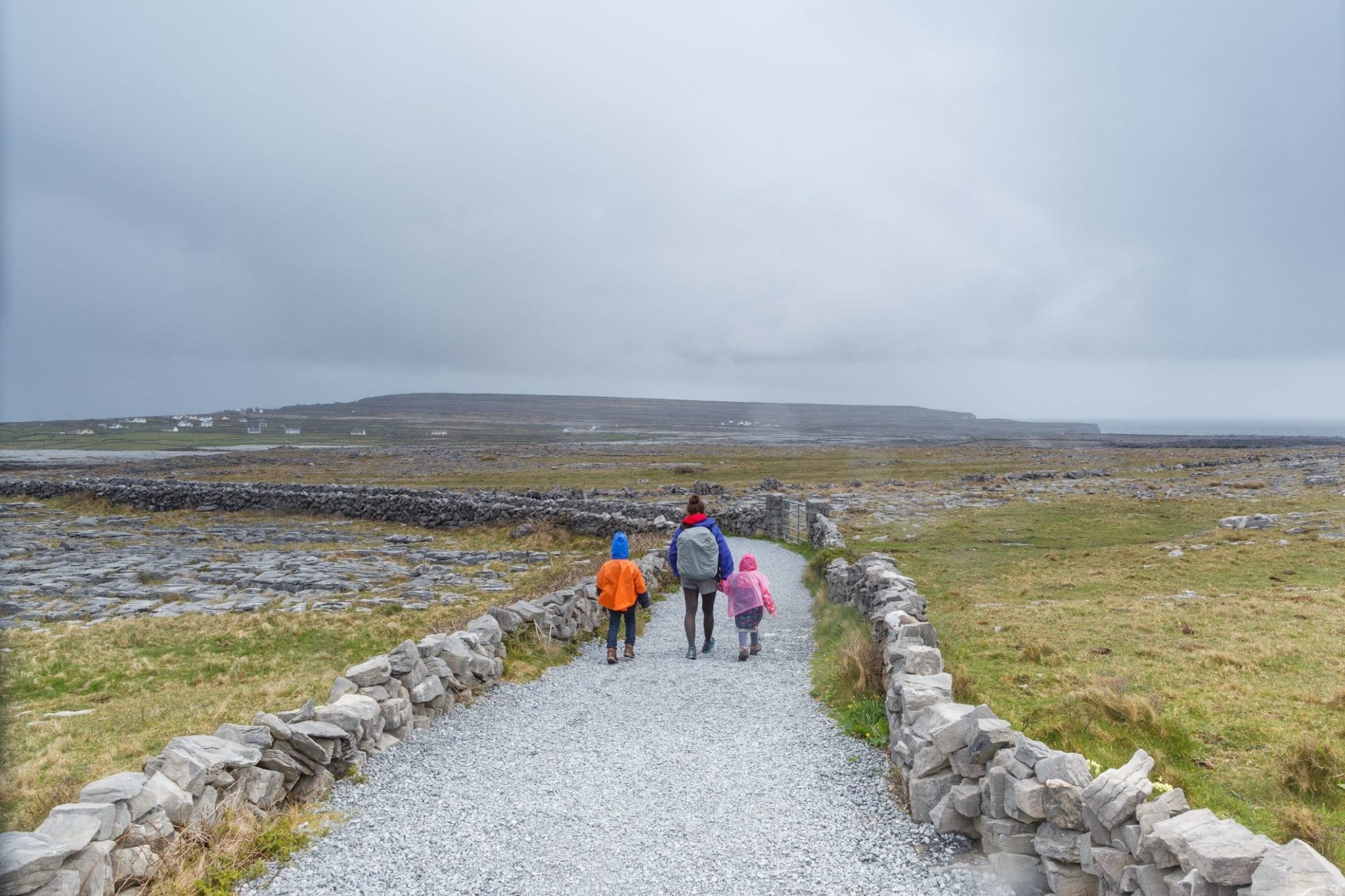 walking stone walls: family in Aran islands