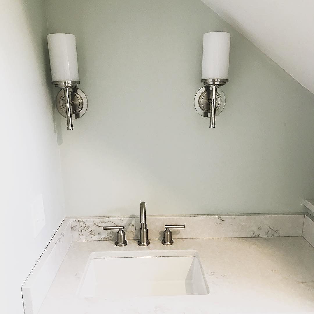 Sconces, countertop, sink & faucet ️ in this small, quirky bathroom #bathroomrenovation #bathroom #mainehomedesign #sconces #quartz #benjaminmoore #homerenovation #homeremodel #interiordesign #smallbutbeautiful #portlandmaine #maine #bluebungalowproject #heartenhome