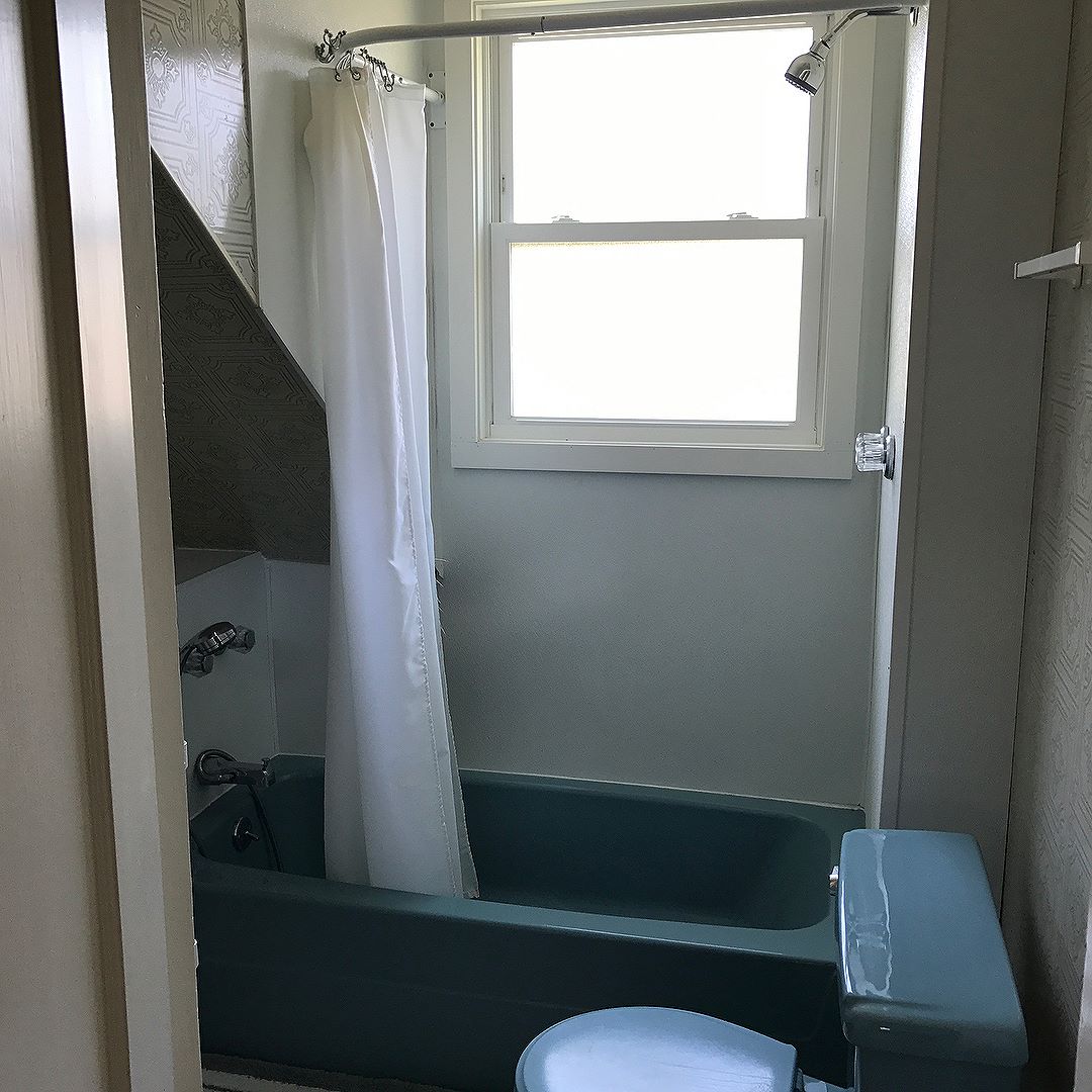 This small, very blue bathroom went from an awkward space to a beautiful bathroom